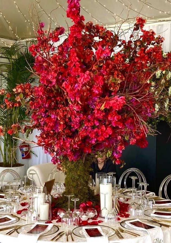Red flower centre piece at a reception - D&D
