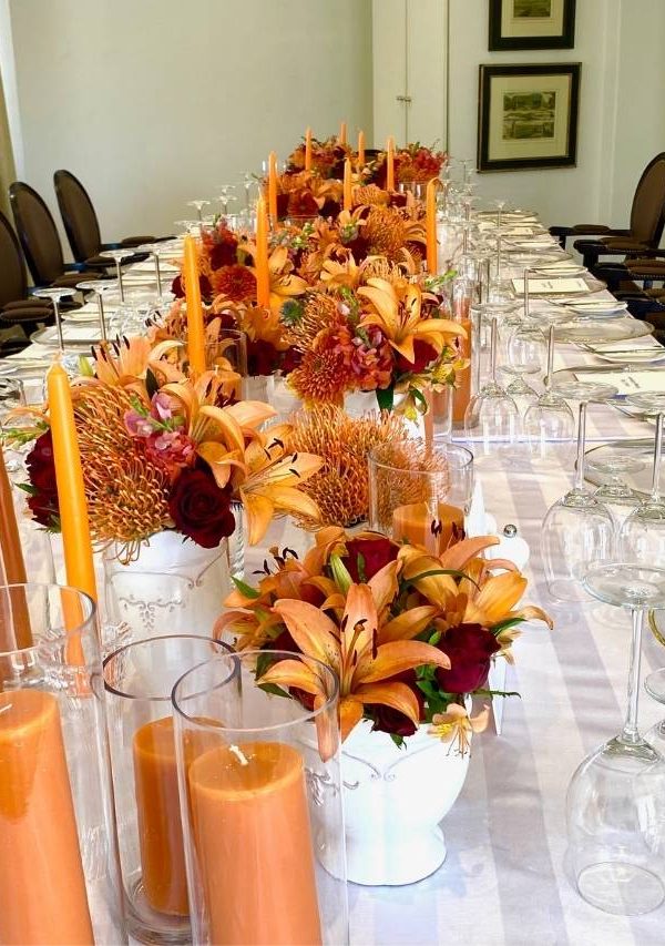 Orange Orchid and Candle Table Decor for a Reception